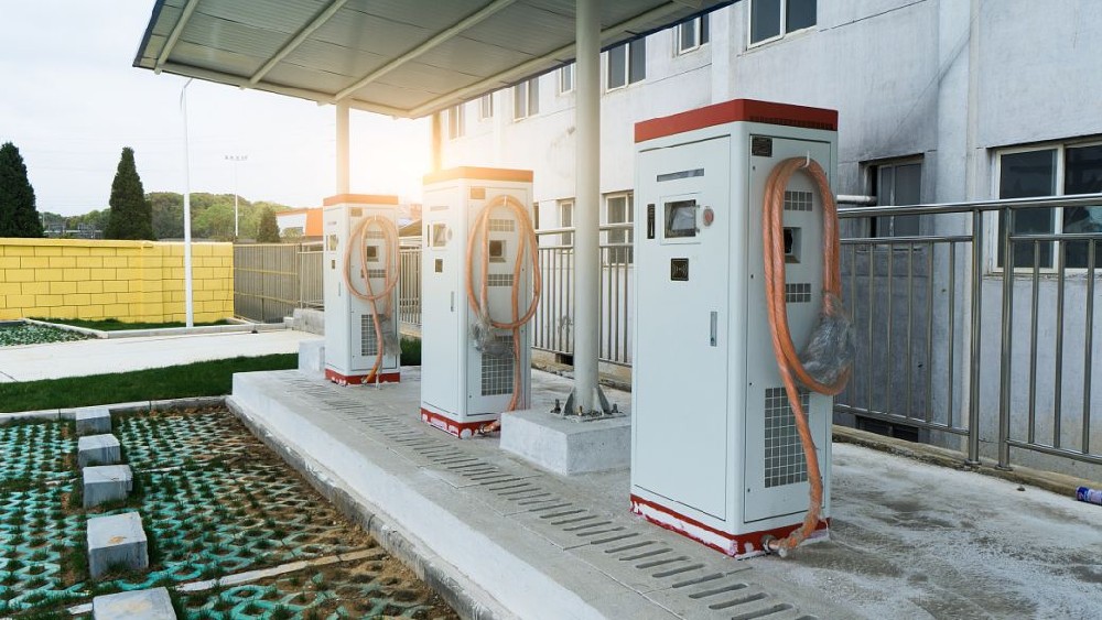 What is the difference between AC charging stations and DC charging stations?